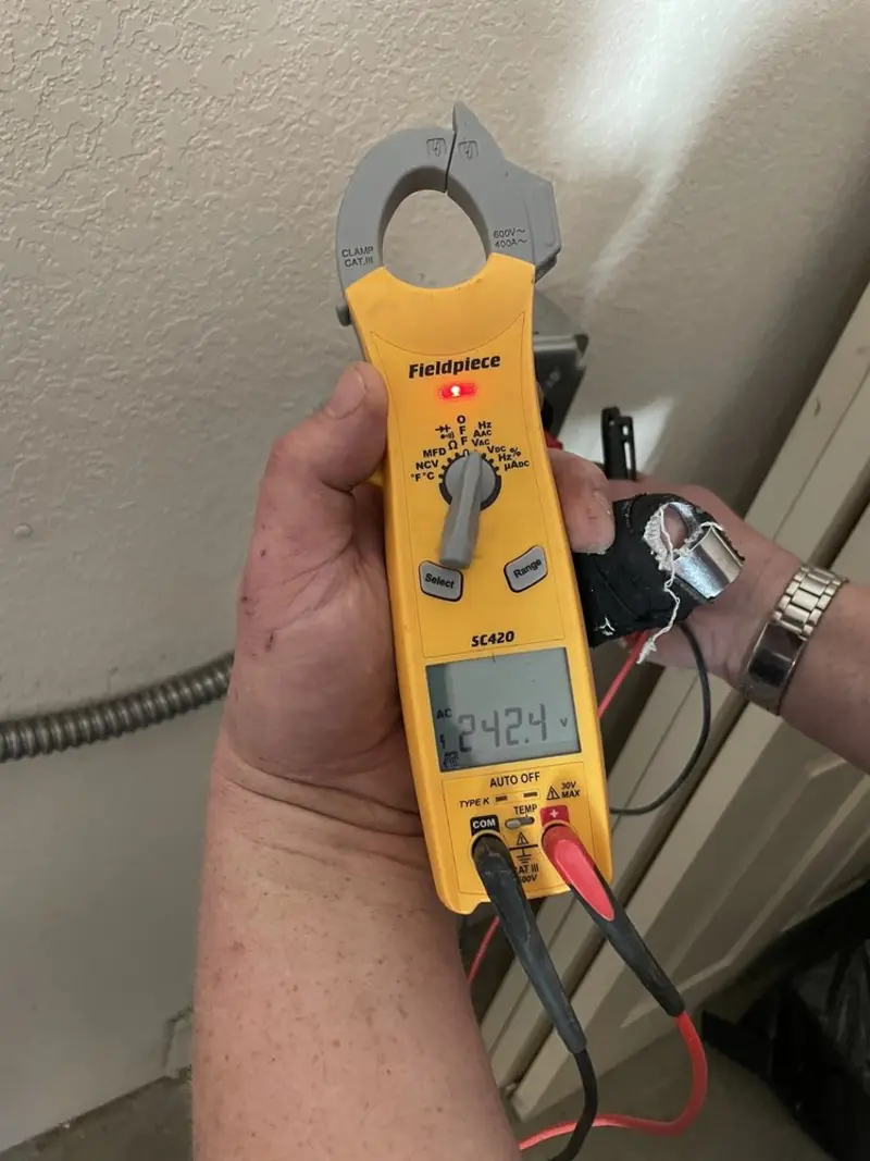 Voltage testing with clamp meter during Generator Installation in Laketown